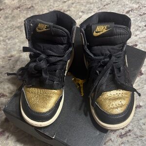 Nike Black and Gold High-Tops